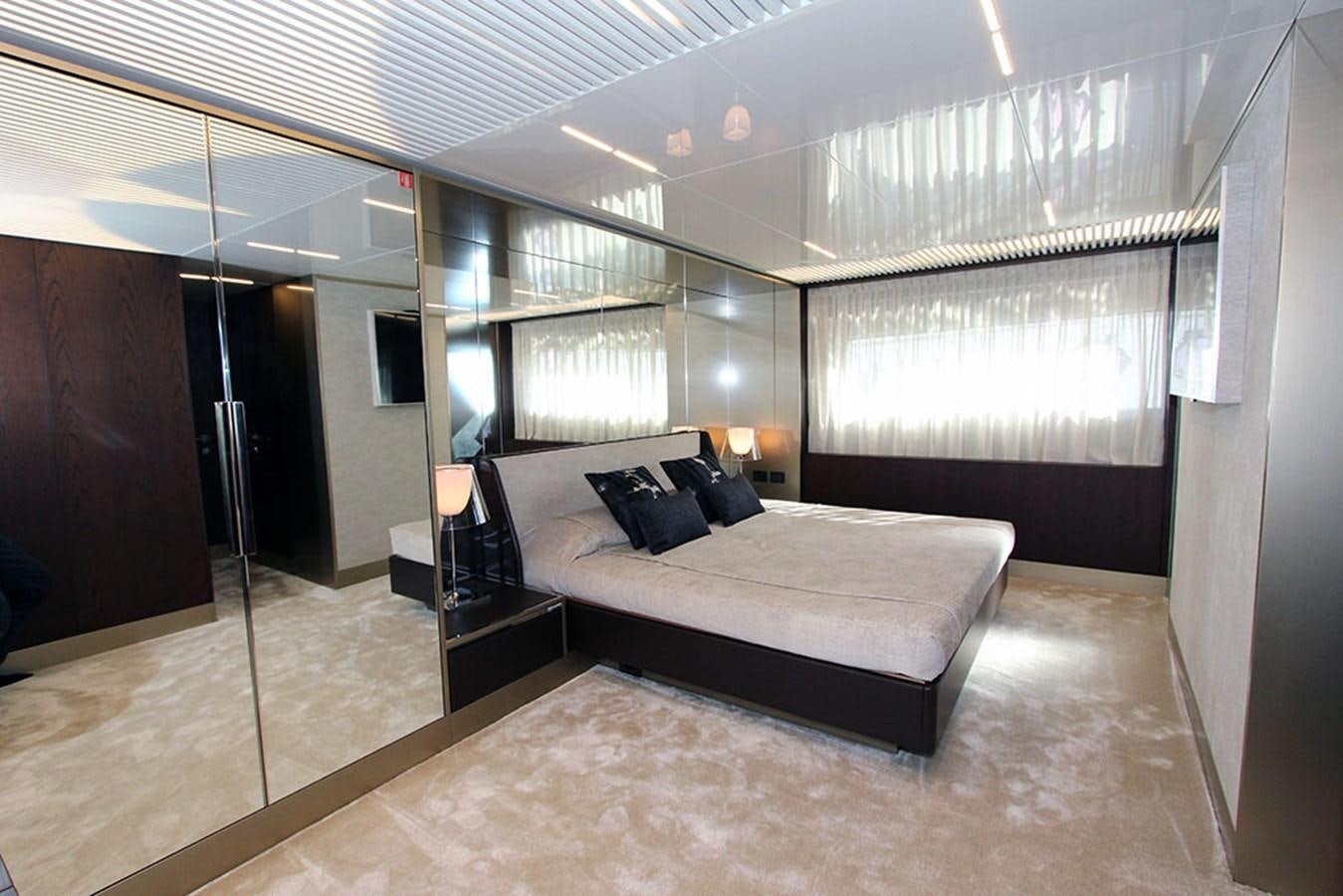 a large bedroom with a large bed aboard ANASSA A Yacht for Sale