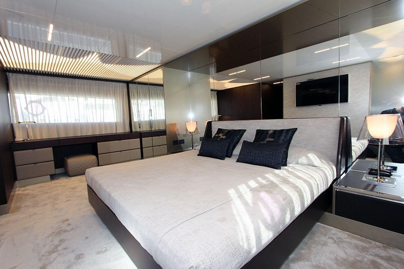 a large bed in a room aboard ANASSA A Yacht for Sale