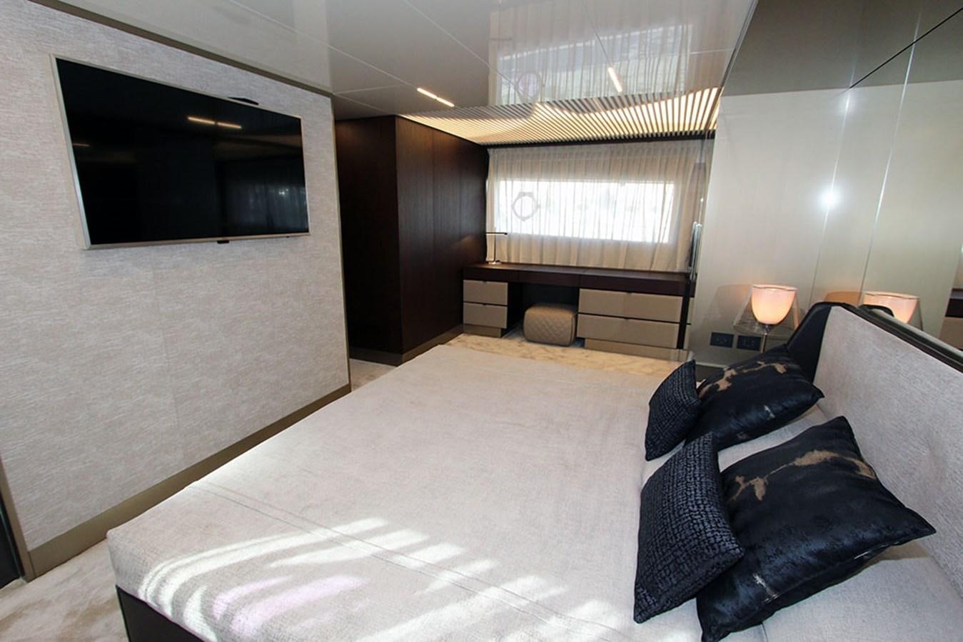 a large bedroom with a bed aboard ANASSA A Yacht for Sale