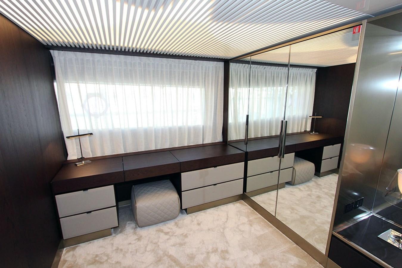 a room with a bed and a desk aboard ANASSA A Yacht for Sale