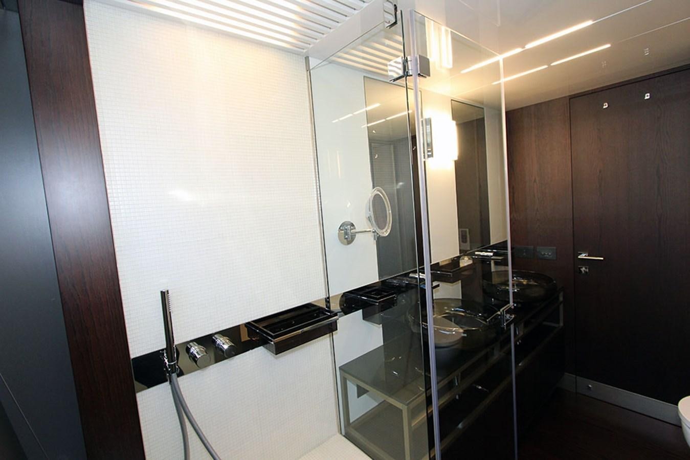 a bathroom with a glass shower aboard ANASSA A Yacht for Sale