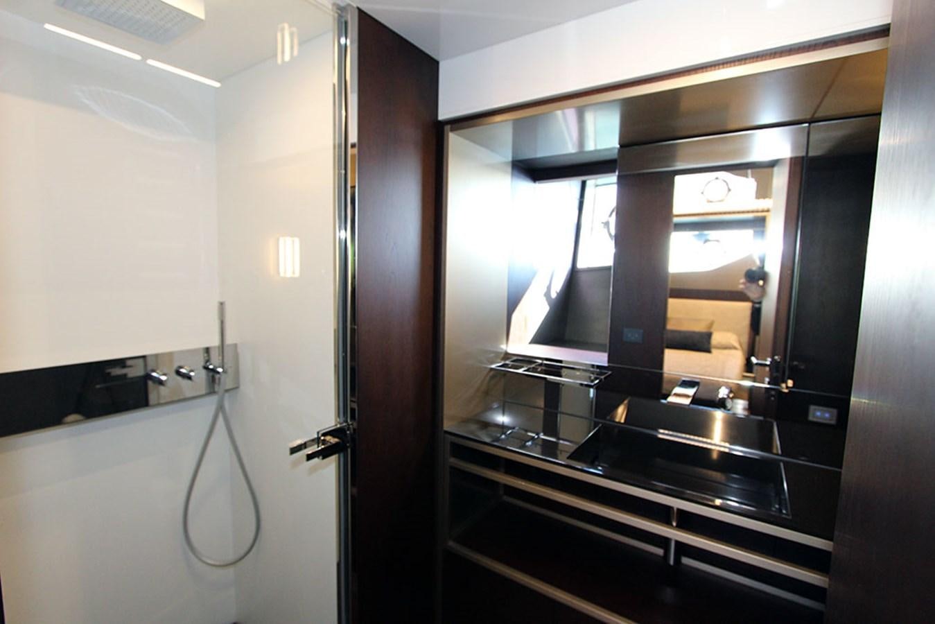 a bathroom with a large mirror aboard ANASSA A Yacht for Sale