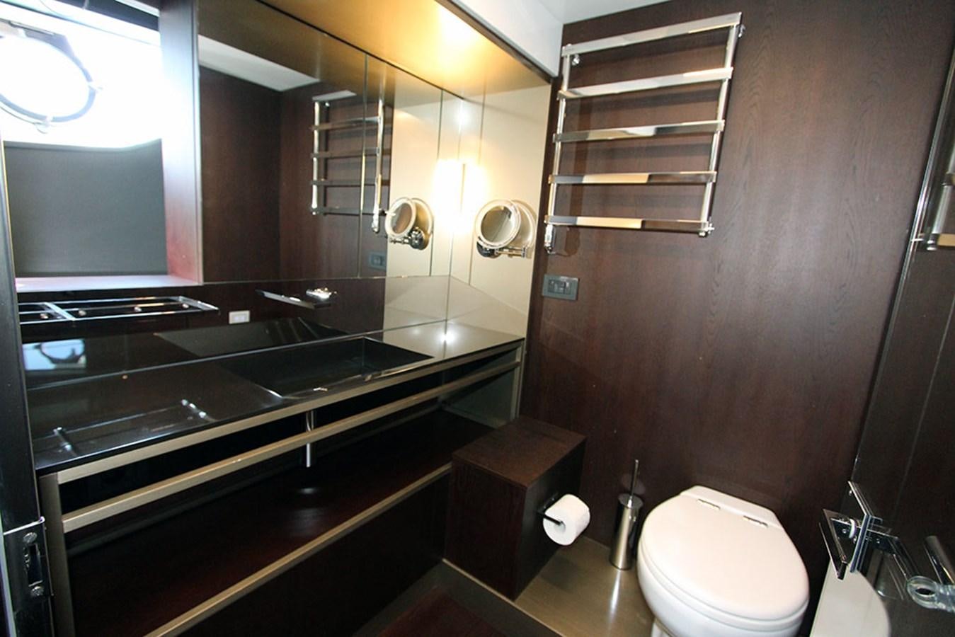 a bathroom with a large mirror aboard ANASSA A Yacht for Sale