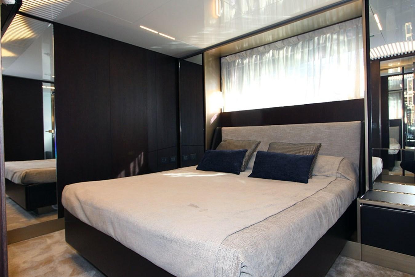 a bed with a white sheet aboard ANASSA A Yacht for Sale