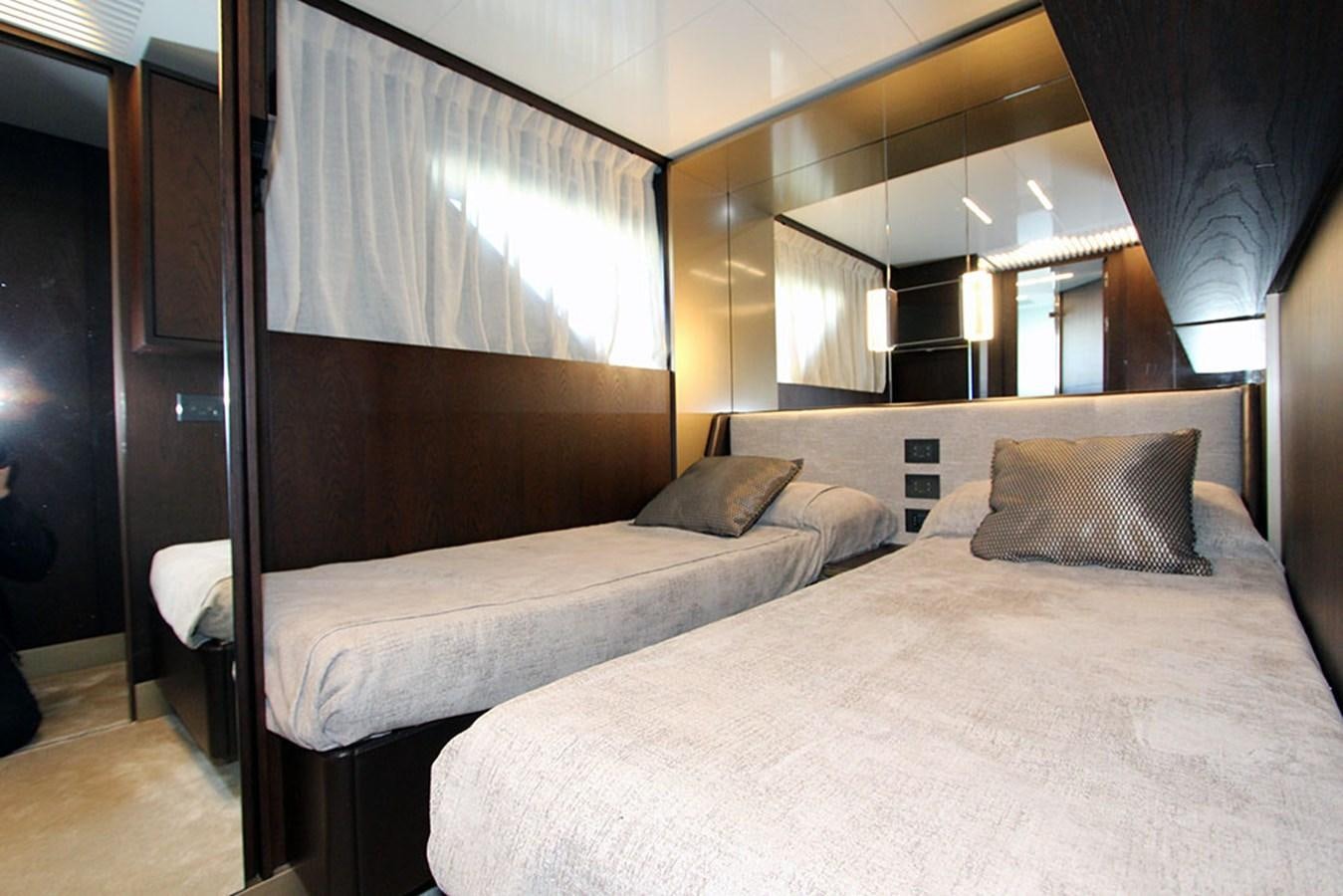 a room with two beds aboard ANASSA A Yacht for Sale