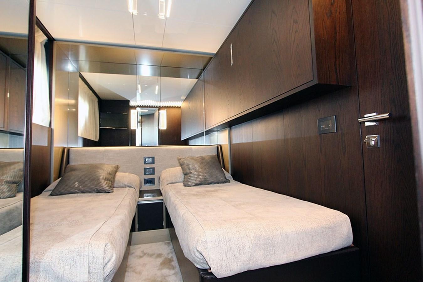 a room with two beds aboard ANASSA A Yacht for Sale