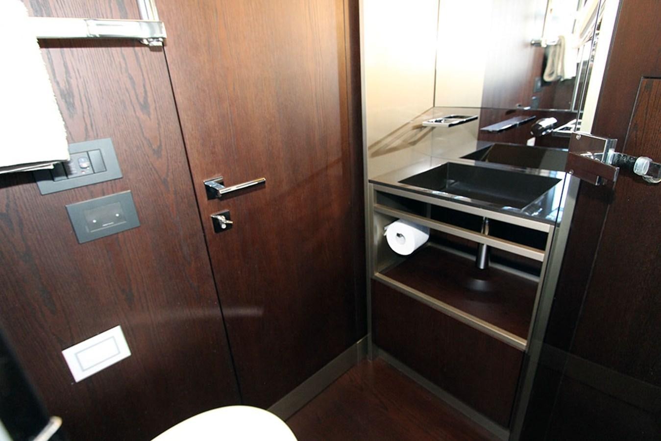 a kitchen with a sink and a mirror aboard ANASSA A Yacht for Sale