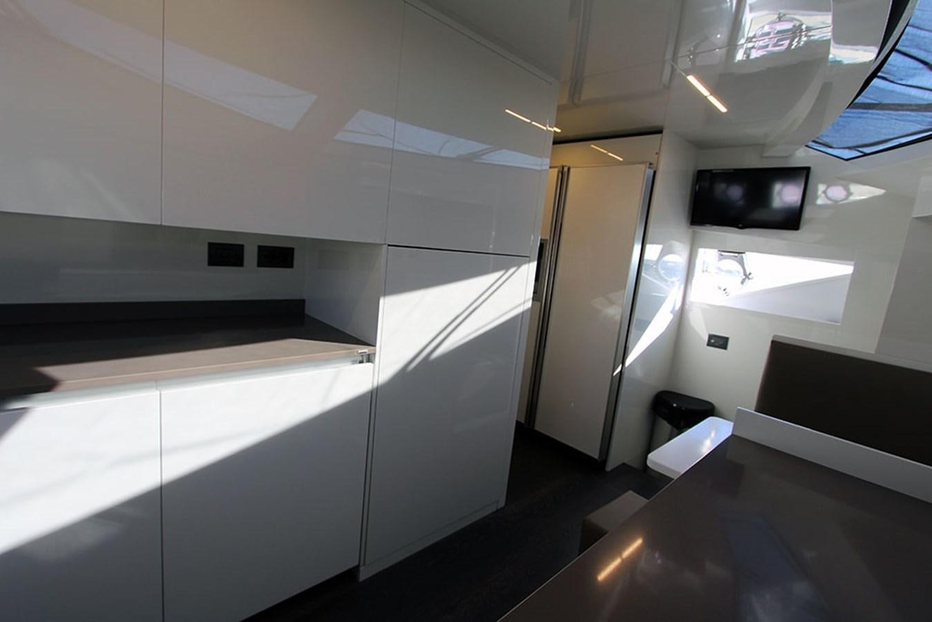 a room with a desk and a tv aboard ANASSA A Yacht for Sale
