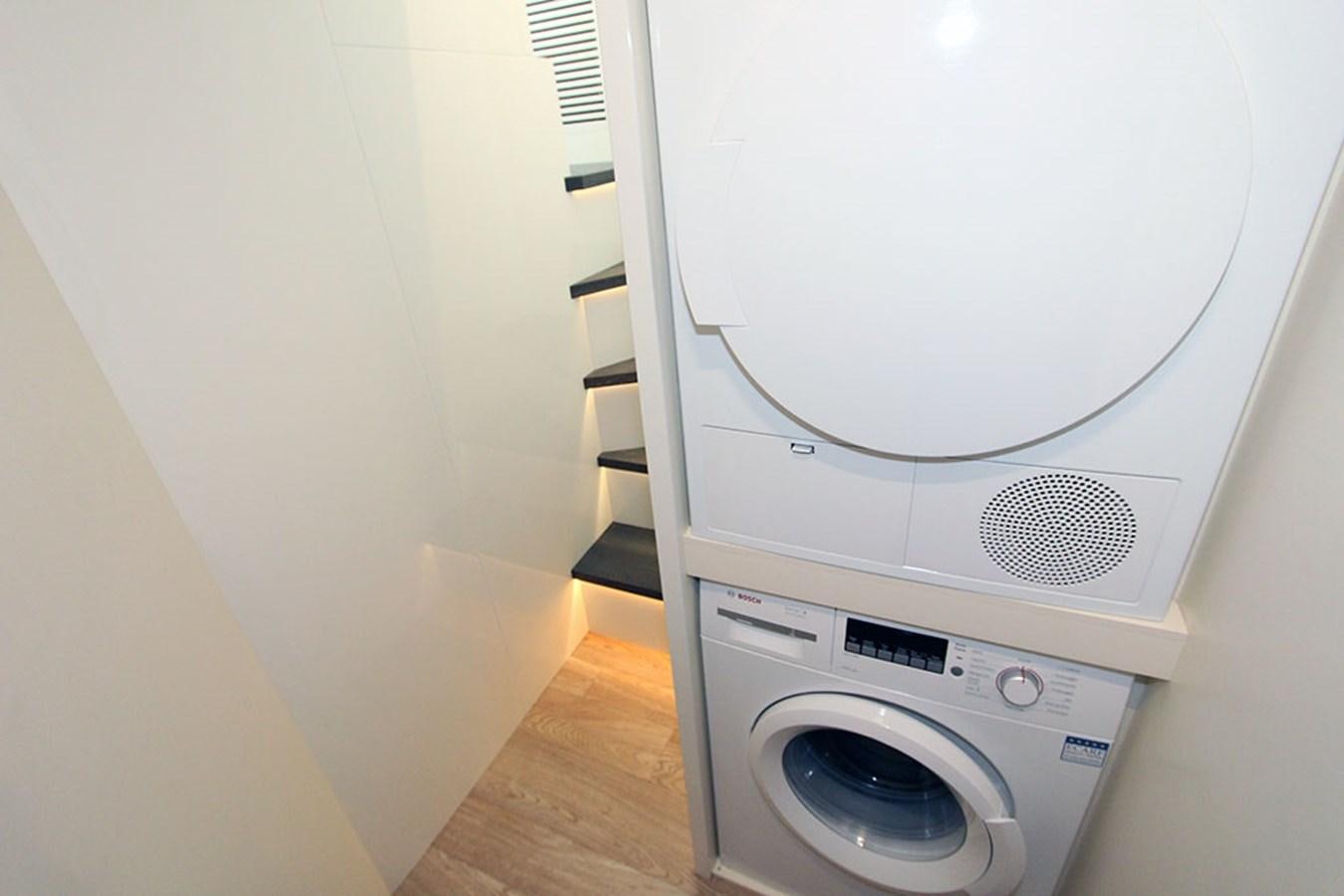 a white washing machine aboard ANASSA A Yacht for Sale