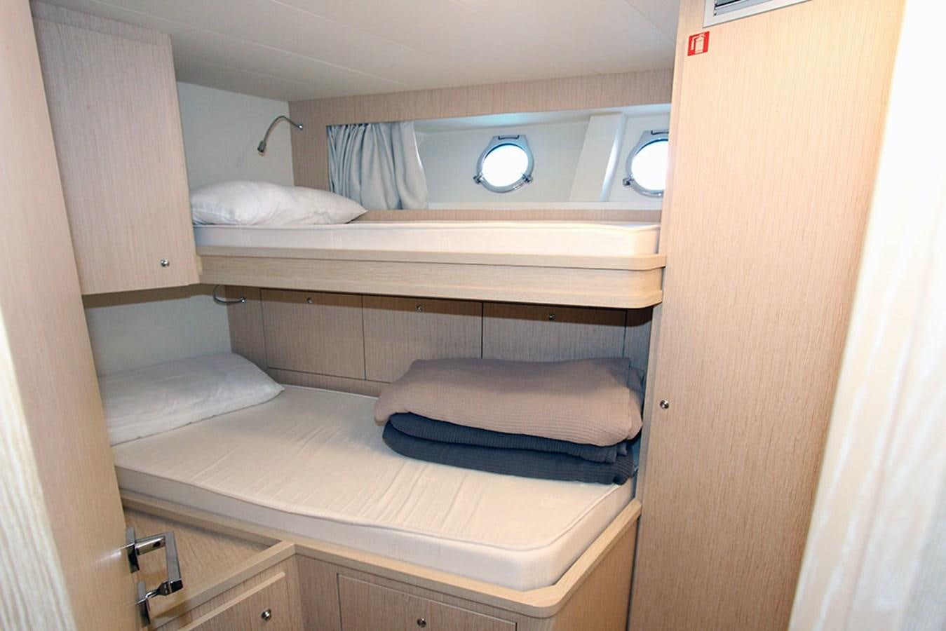 a room with bunk beds aboard ANASSA A Yacht for Sale