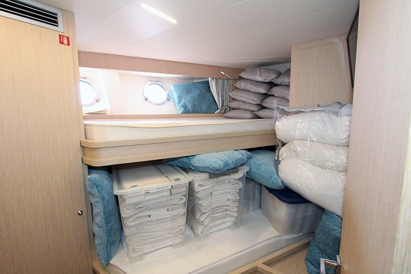 a room with a bed and a dryer aboard ANASSA A Yacht for Sale