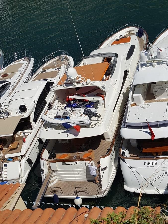 a group of boats are parked aboard BARON B Yacht for Sale