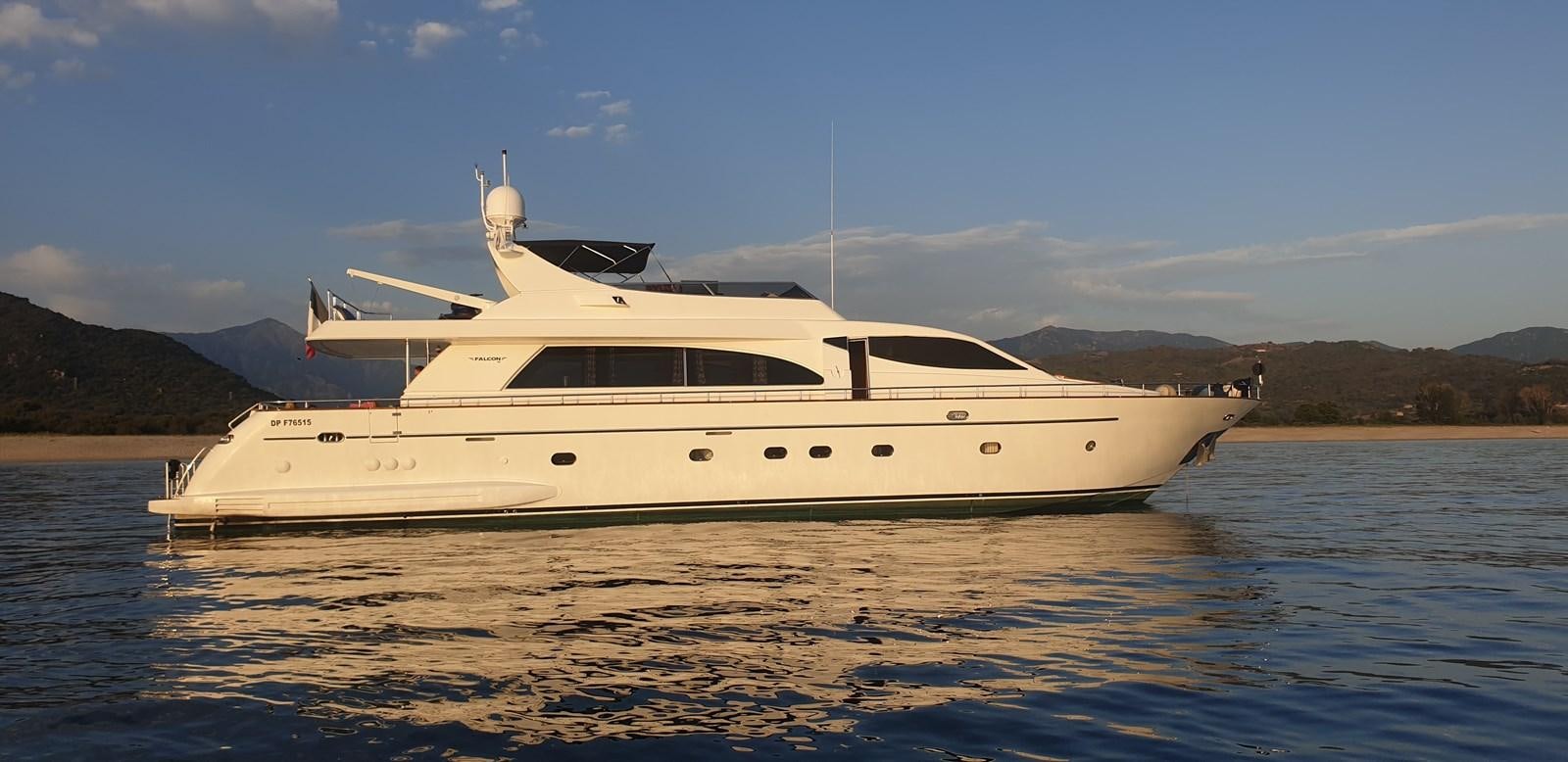 a white yacht on the water aboard BARON B Yacht for Sale