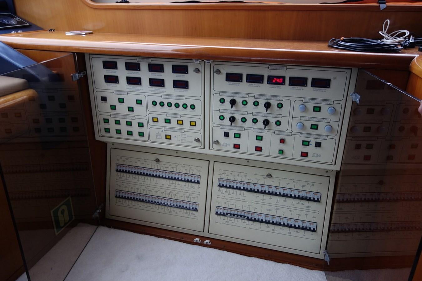 a white computer with a black and red keyboard aboard BARON B Yacht for Sale