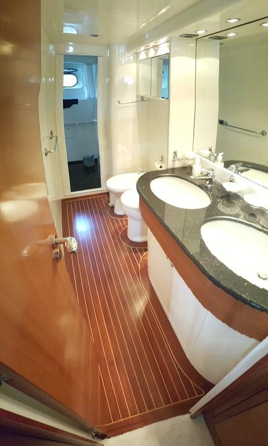 a bathroom with a sink and a toilet aboard BARON B Yacht for Sale
