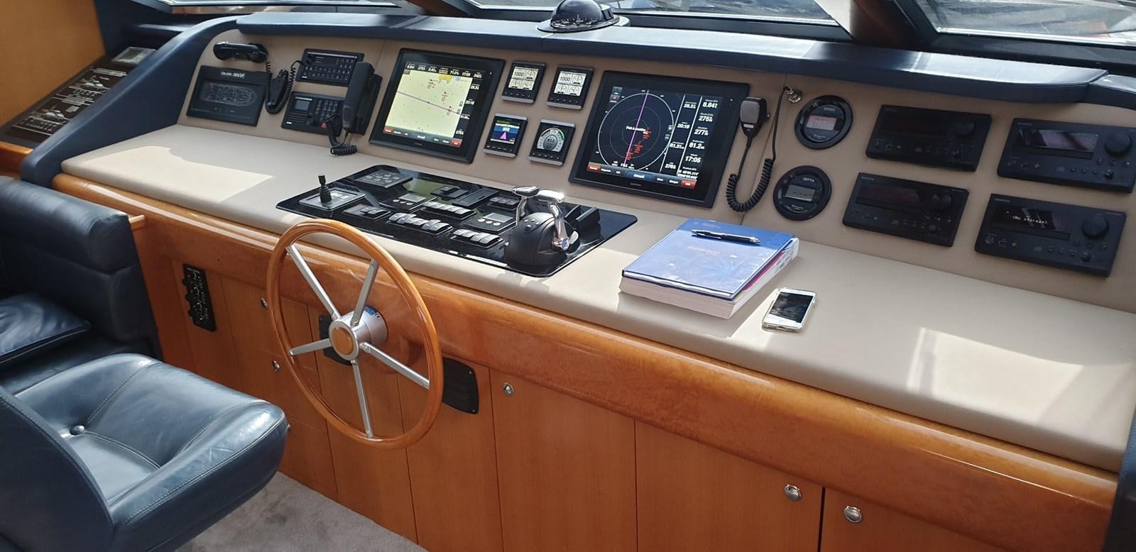 a control panel with a keyboard and a phone on it aboard BARON B Yacht for Sale