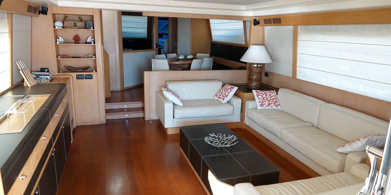 a living room with a couch and a table aboard 4 FIVE Yacht for Sale