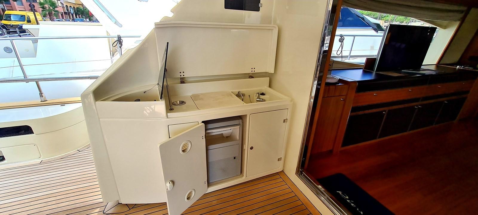 a white cabinet with drawers aboard RITAKI 7 Yacht for Sale