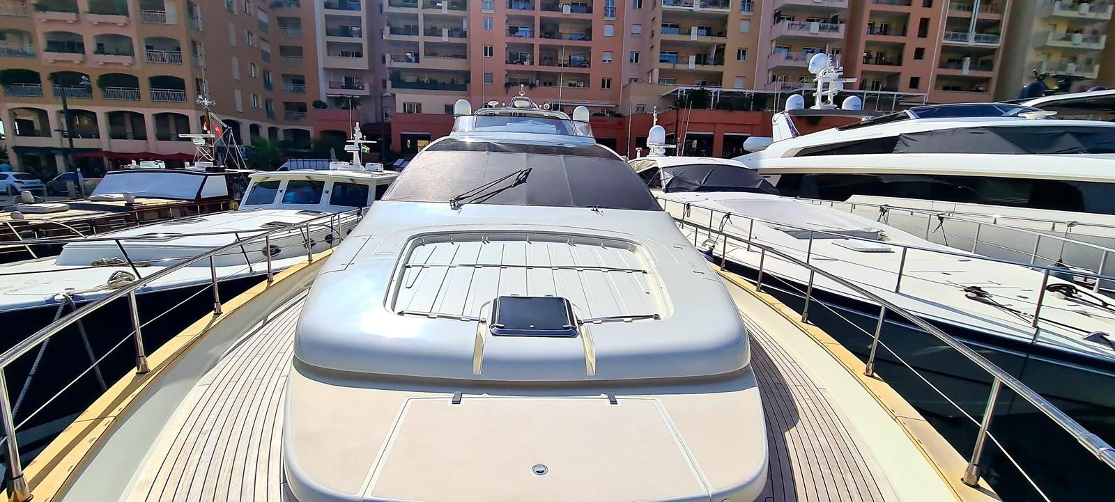 a group of white boats in a harbor aboard RITAKI 7 Yacht for Sale