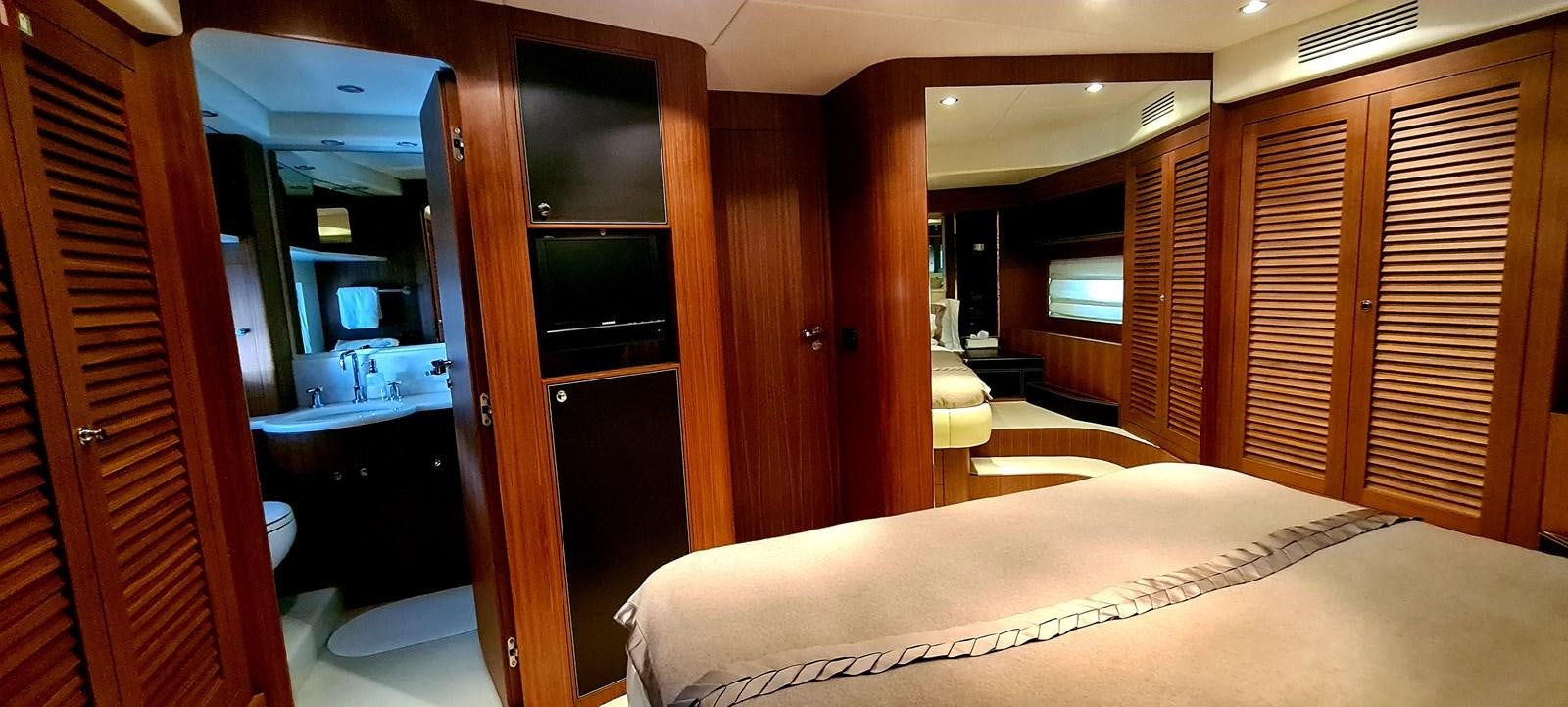 a room with a bed and a closet aboard RITAKI 7 Yacht for Sale