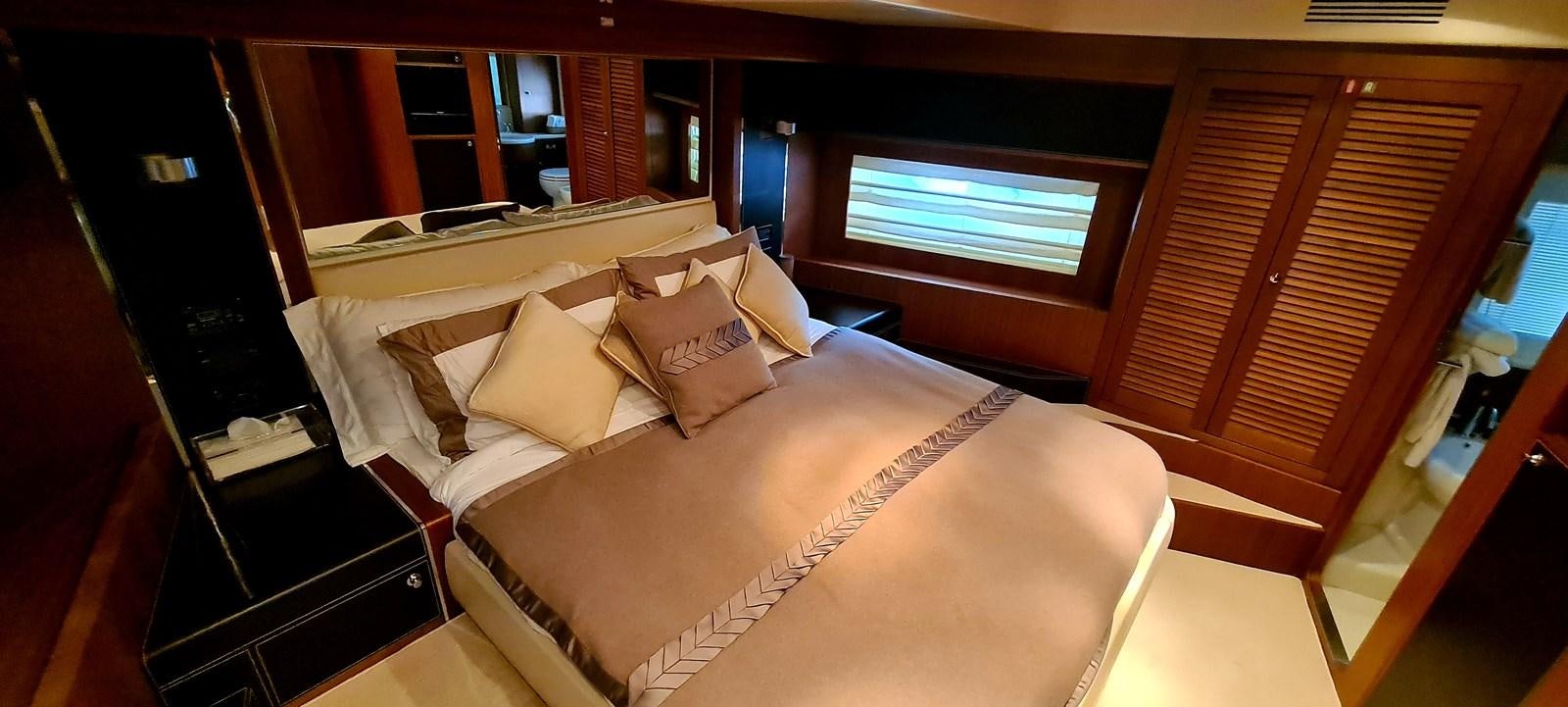 a bed in a room aboard RITAKI 7 Yacht for Sale