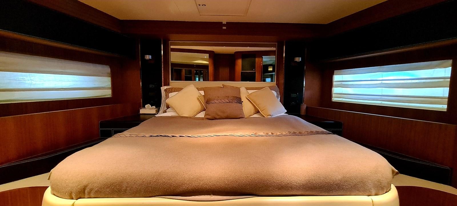 a bed with pillows aboard RITAKI 7 Yacht for Sale