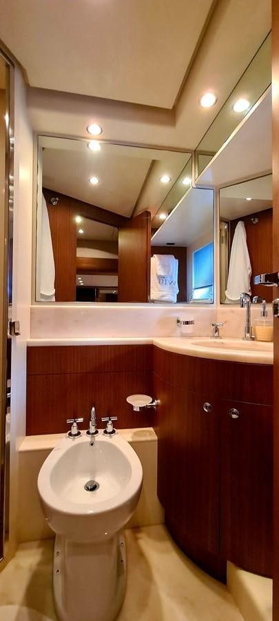a bathroom with a sink and a mirror aboard RITAKI 7 Yacht for Sale
