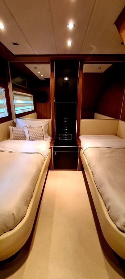 a room with a couple of beds aboard RITAKI 7 Yacht for Sale