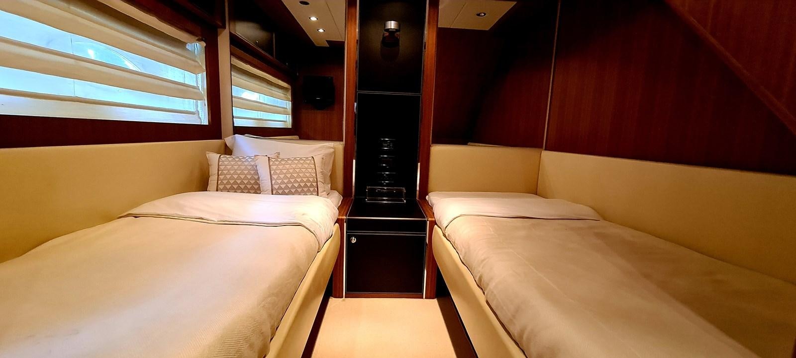 a room with two beds aboard RITAKI 7 Yacht for Sale