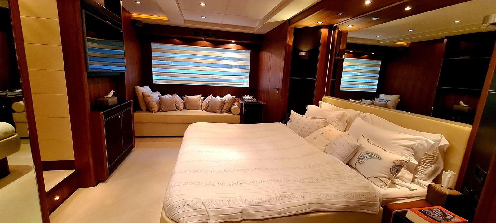 a room with a bed and a window aboard RITAKI 7 Yacht for Sale