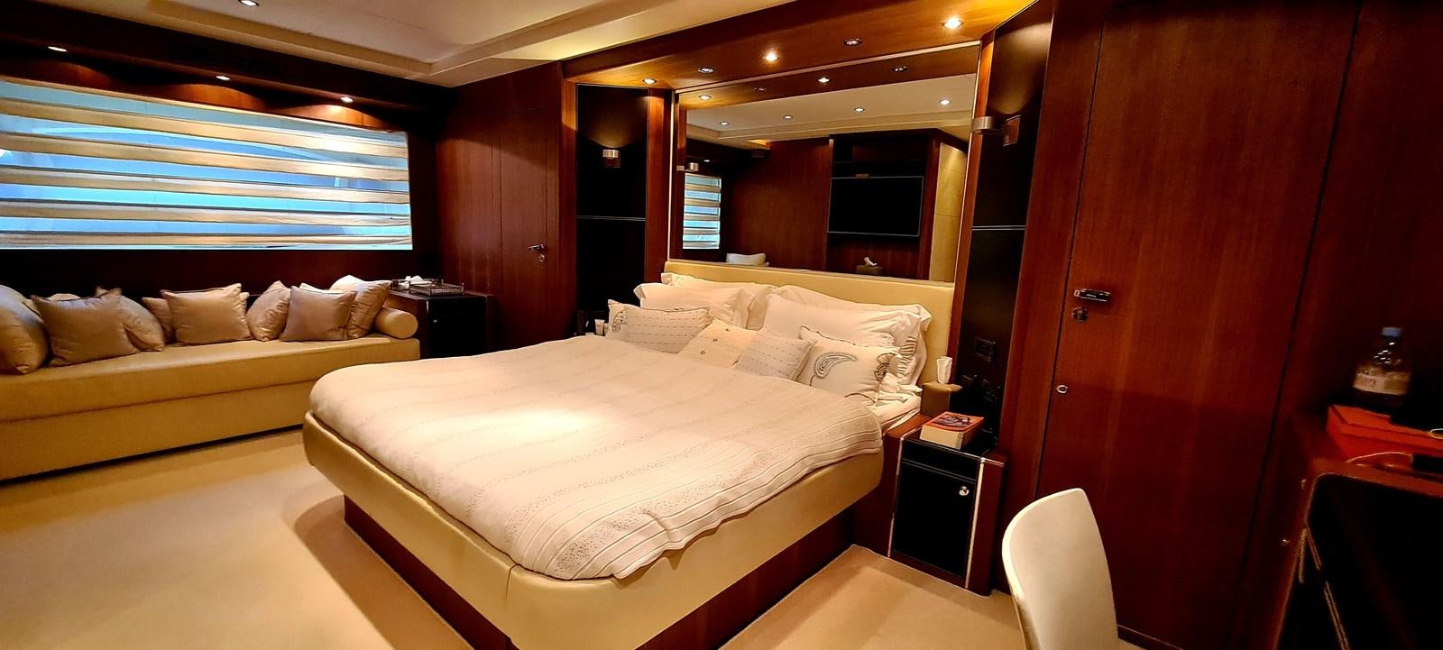 a room with a bed and a couch aboard RITAKI 7 Yacht for Sale
