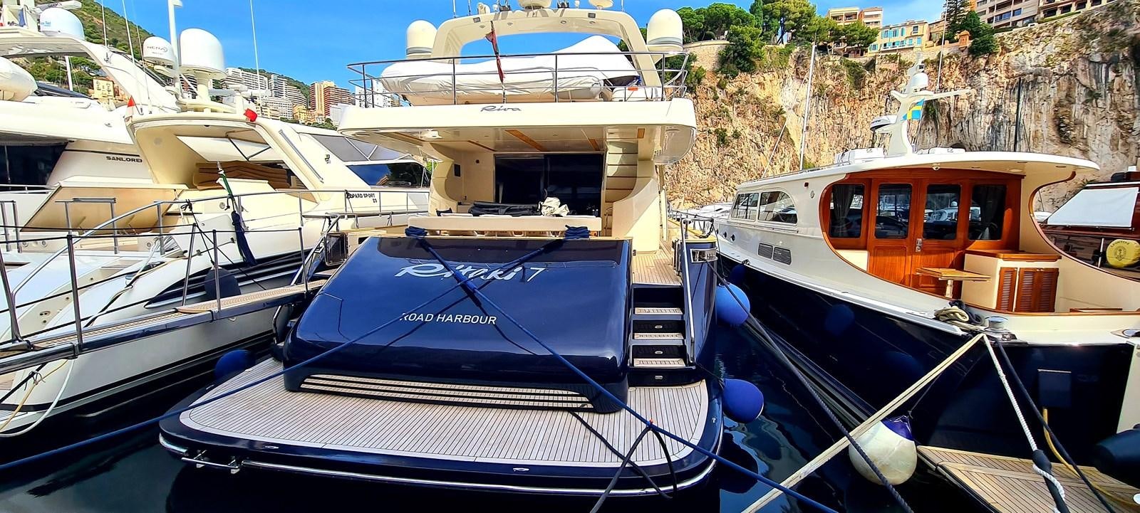 boats docked in a harbor aboard RITAKI 7 Yacht for Sale