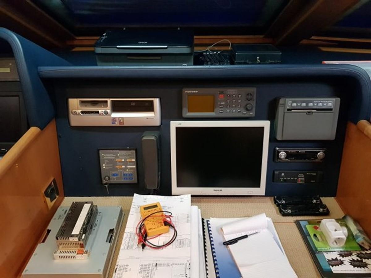 a computer on a desk aboard BLUE DEEP Yacht for Sale