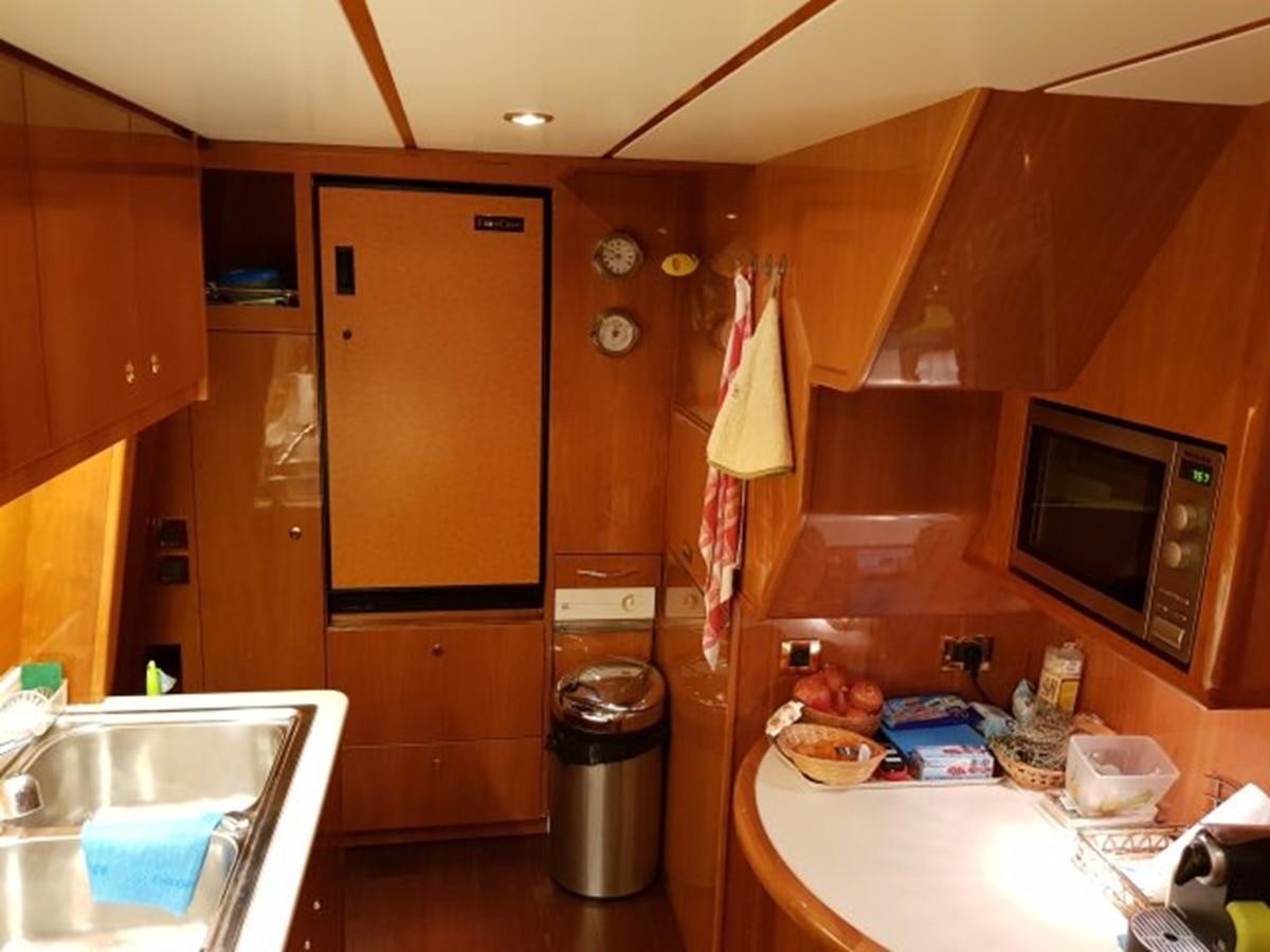 a kitchen with a sink and microwave aboard BLUE DEEP Yacht for Sale