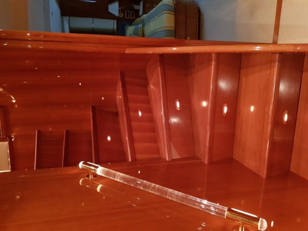 a long table with a metal bar aboard BLUE DEEP Yacht for Sale