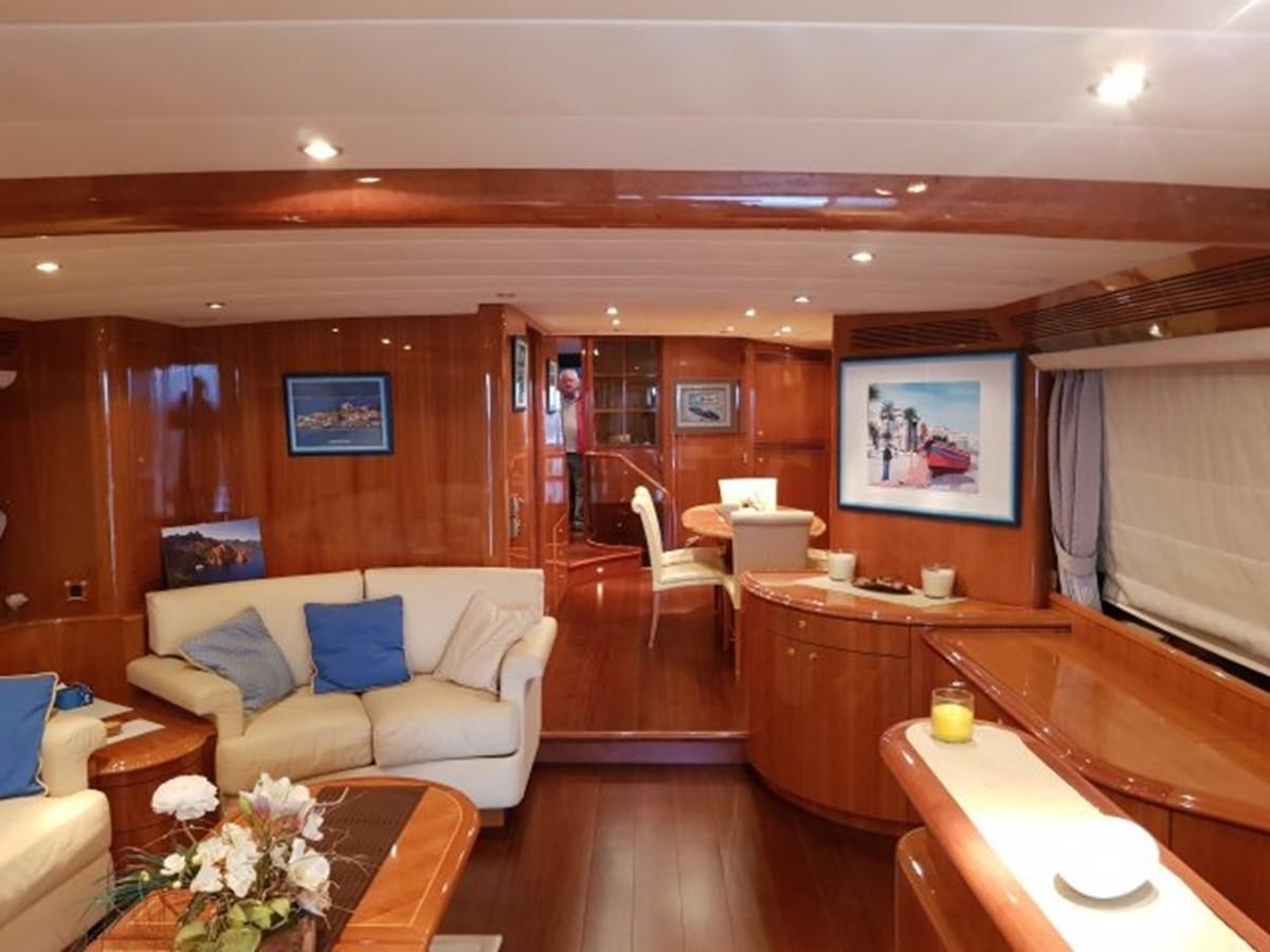 a living room with a couch and a table aboard BLUE DEEP Yacht for Sale