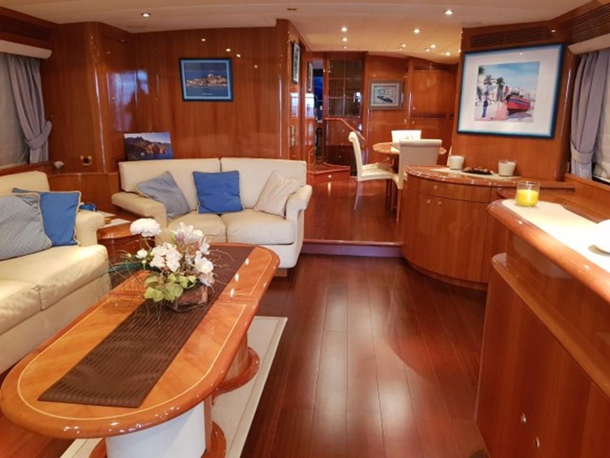 a living room with a couch and a table aboard BLUE DEEP Yacht for Sale