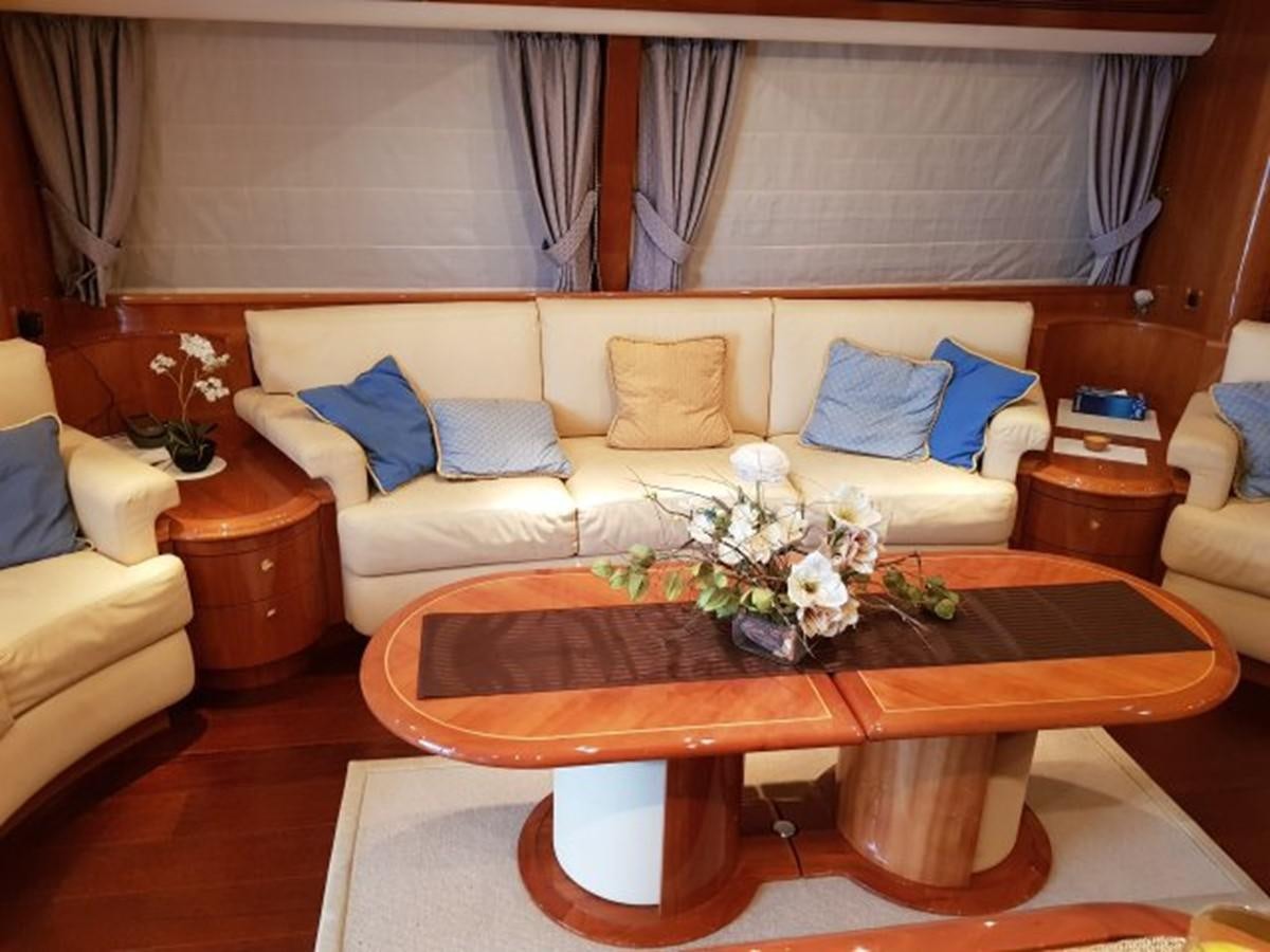 a table with flowers on it aboard BLUE DEEP Yacht for Sale