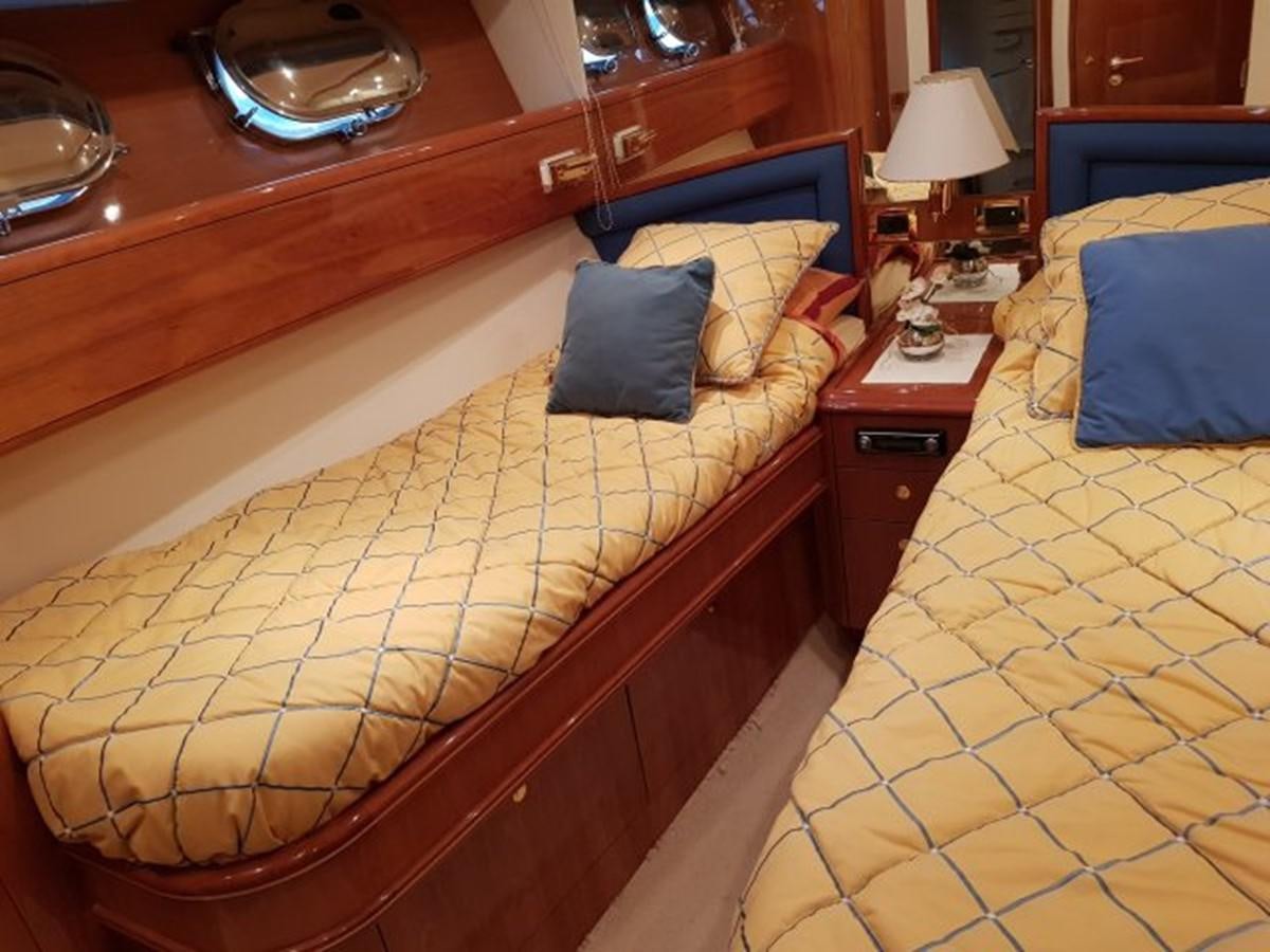 a bed with a couple of beds aboard BLUE DEEP Yacht for Sale