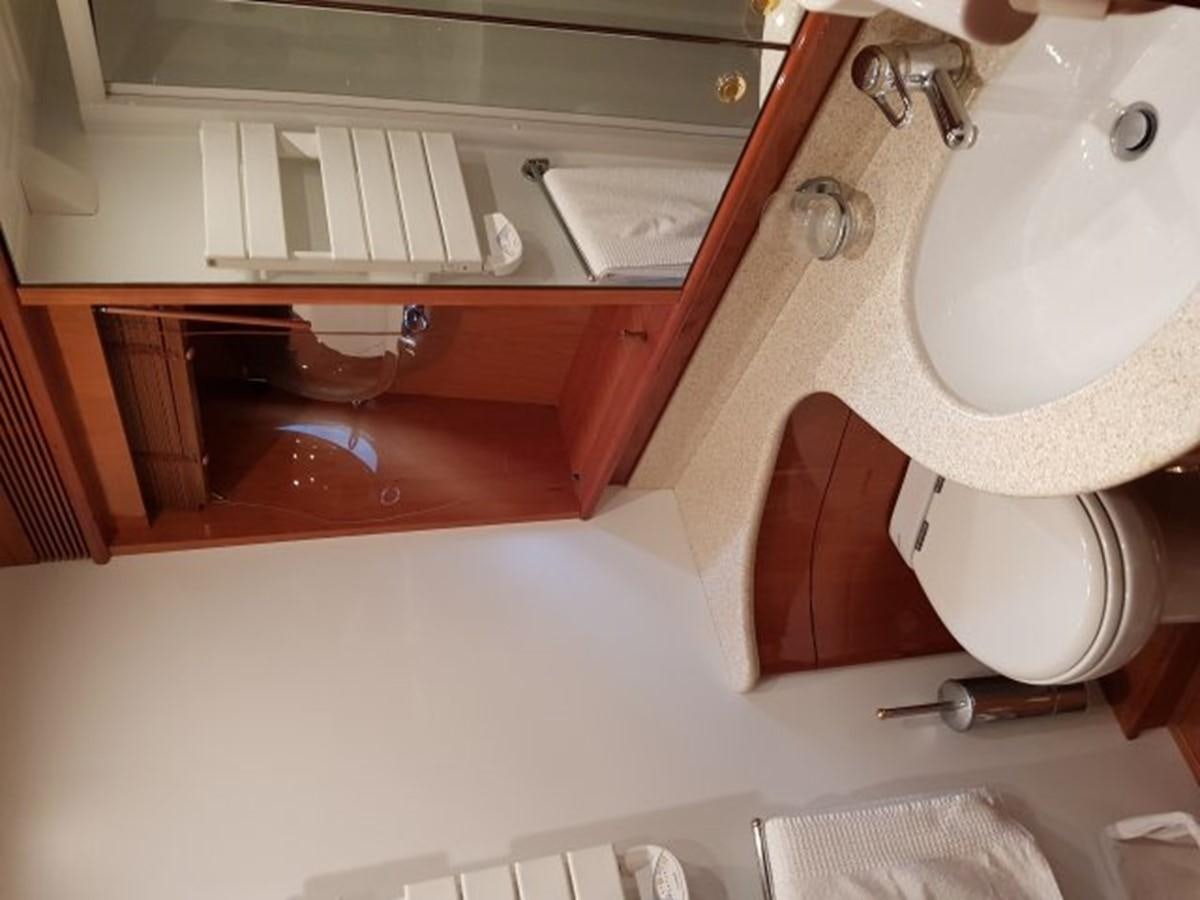 a bathroom with a sink and toilet aboard BLUE DEEP Yacht for Sale