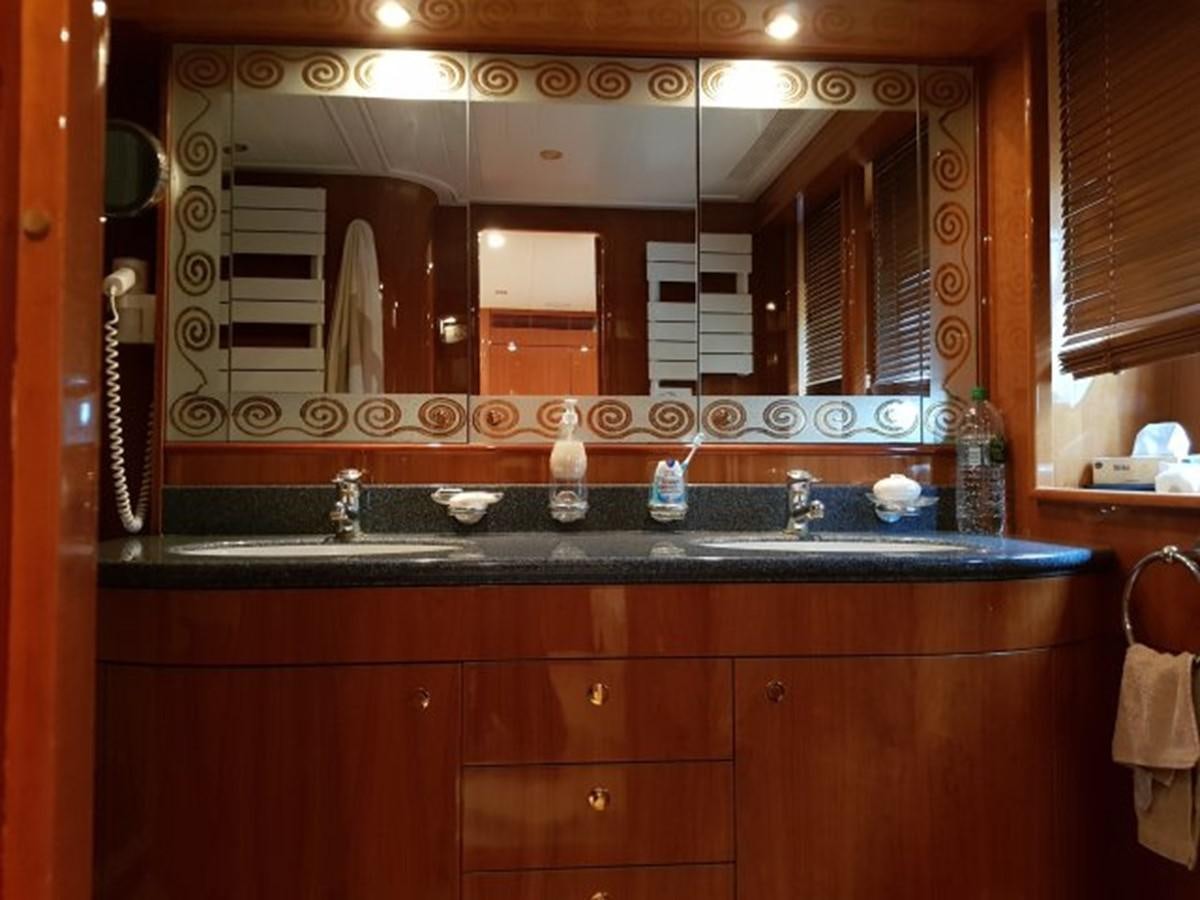 a bathroom with a large mirror aboard BLUE DEEP Yacht for Sale