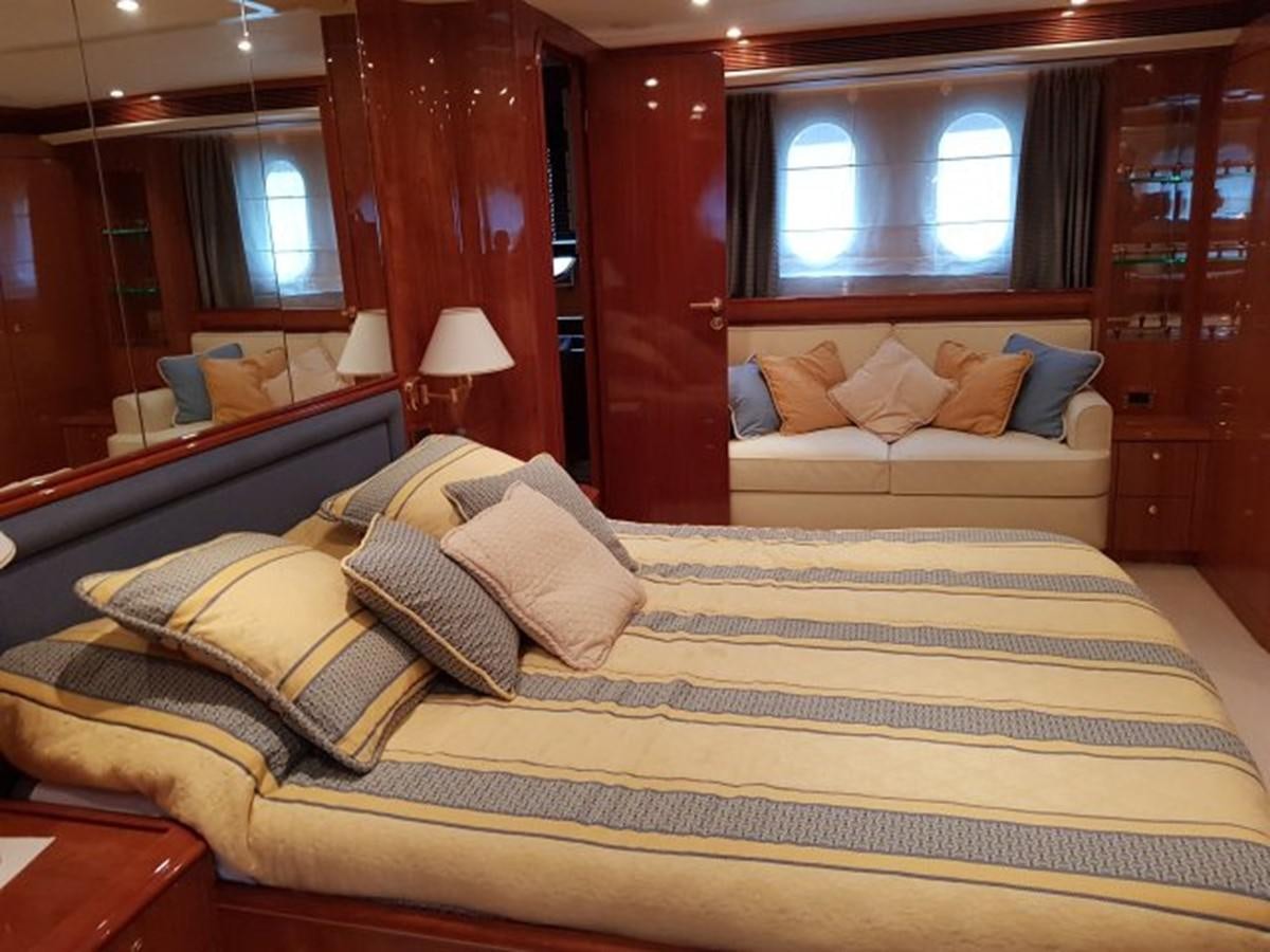 a bed with a large bed aboard BLUE DEEP Yacht for Sale