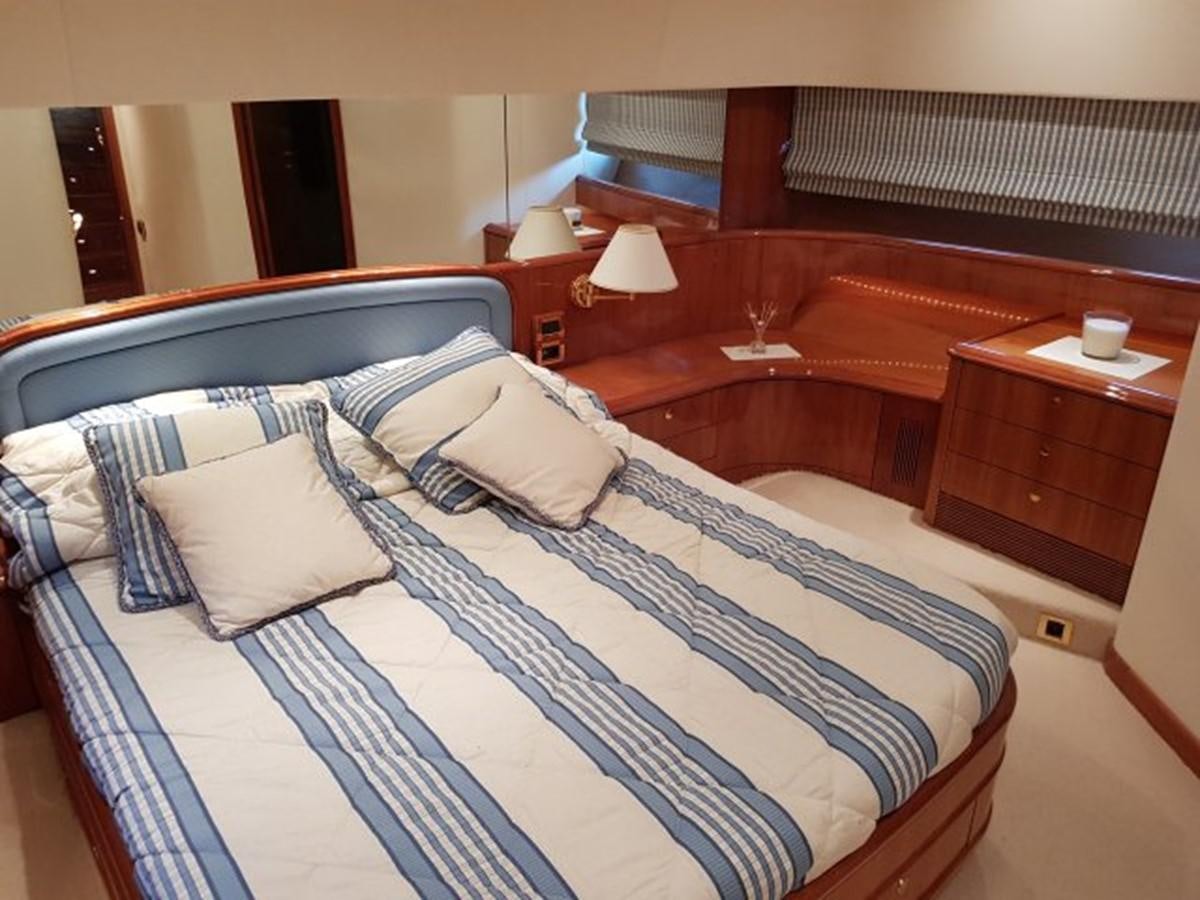 a bed with pillows aboard BLUE DEEP Yacht for Sale