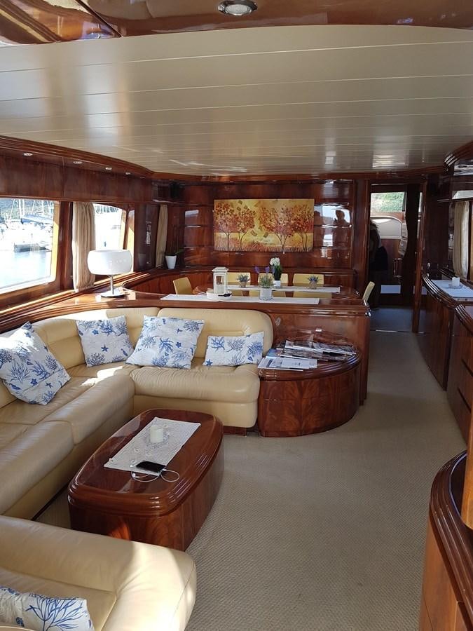 a living room with a couch and a coffee table aboard GEMINI 3 Yacht for Sale