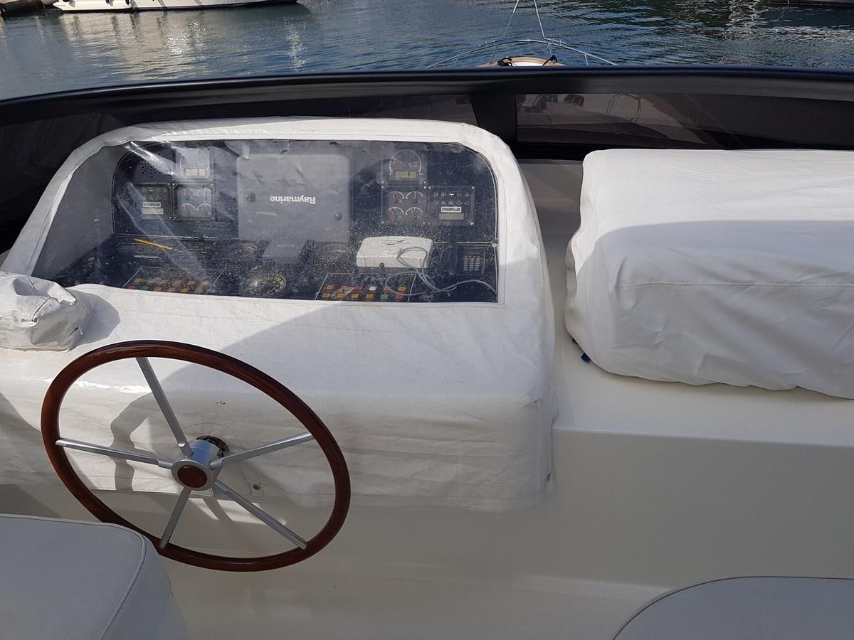 a car with a bicycle wheel aboard GEMINI 3 Yacht for Sale