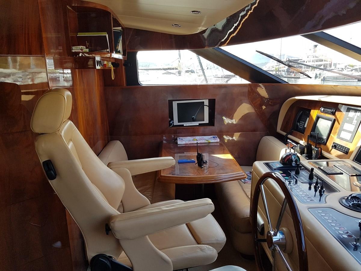 a cabin with a table and chairs aboard GEMINI 3 Yacht for Sale