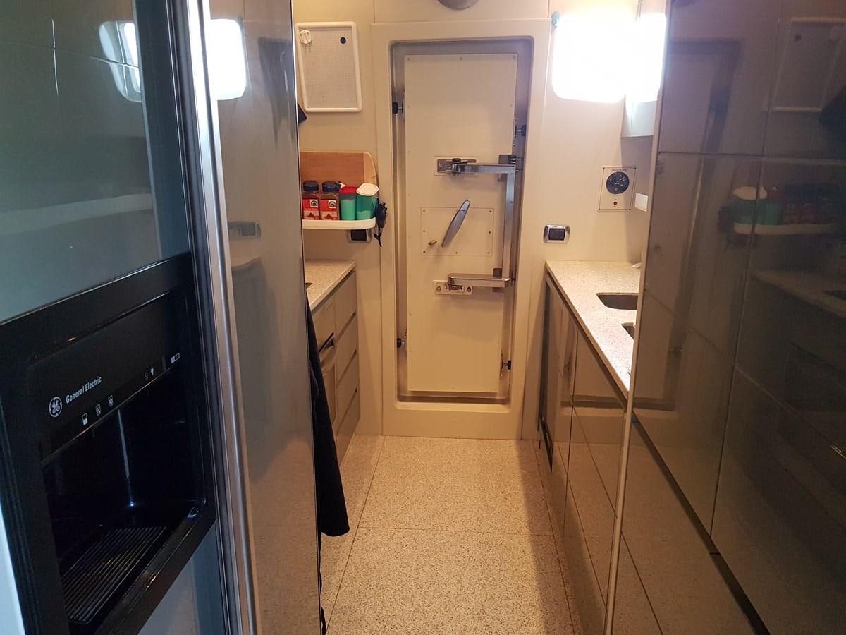 a kitchen with a white counter and cabinets aboard GEMINI 3 Yacht for Sale