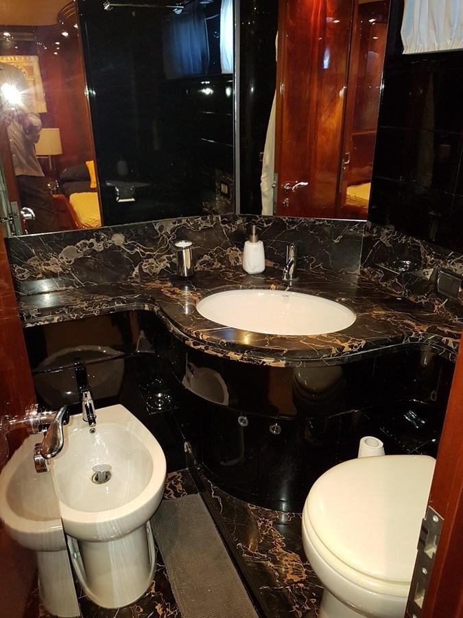 a bathroom with a large mirror aboard GEMINI 3 Yacht for Sale