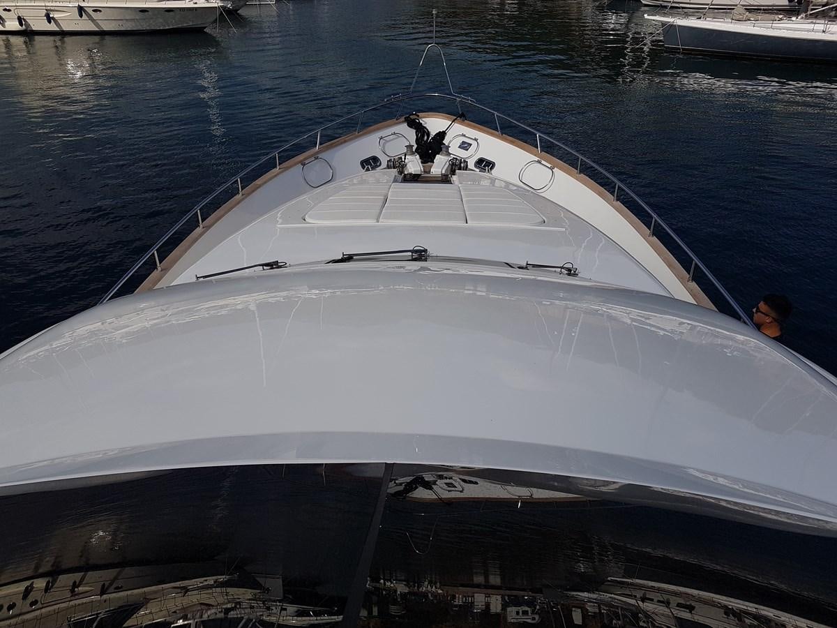a white boat with a group of people on it aboard GEMINI 3 Yacht for Sale