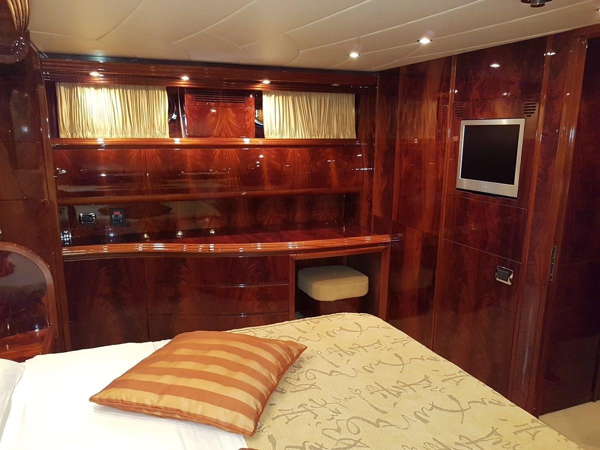a bed with a wooden headboard aboard GEMINI 3 Yacht for Sale